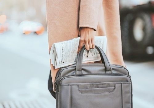 career woman with briefcase, walking to work