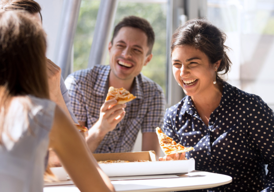 career woman who has control of her eating habits, eating pizza